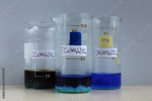 The ammonia complex of copper sulfate, tetraammine copper sulfate in the form of a blue precipitate in a beaker, with the chemical formula.