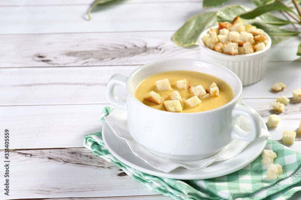 cream cheese soup with crackers on a light background cream cheese soup with crackers on a light background