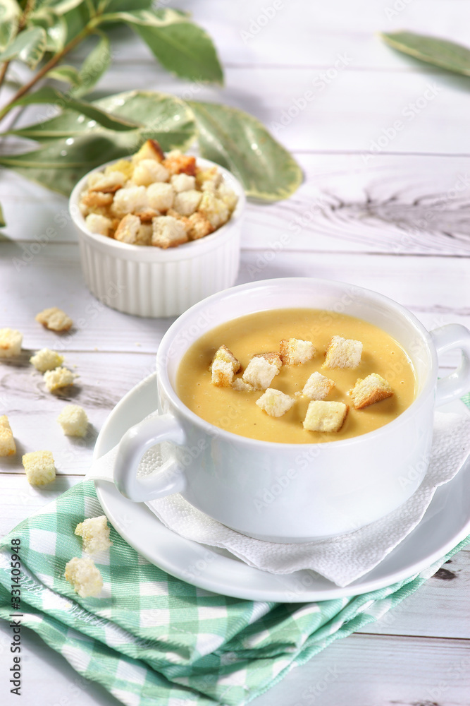cream cheese soup with crackers on a light background cream cheese soup with crackers on a light background