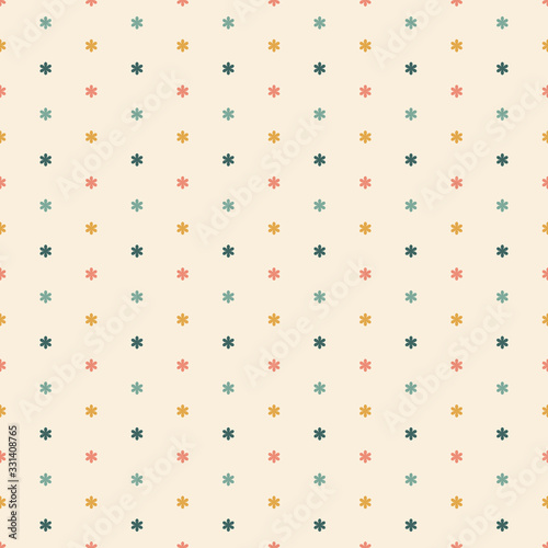 Seamless pattern of small multicoloured flowers on a cream background.
