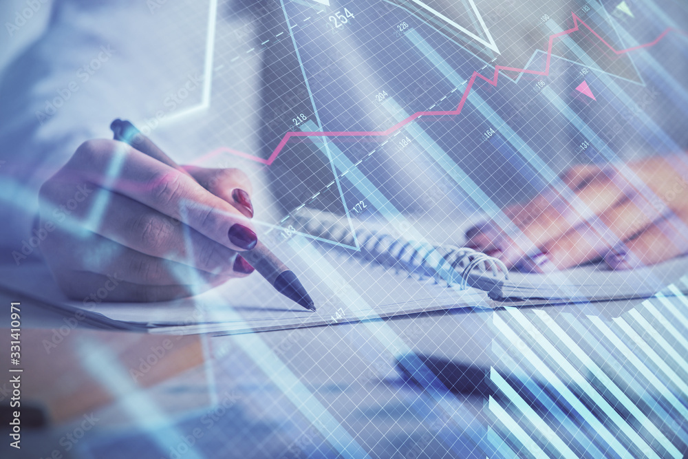 Double exposure of woman's hands making notes with forex graph hologram. Concept stock market analysis. Double exposure of woman's hands making notes with forex graph hologram. Concept stock market analysis.