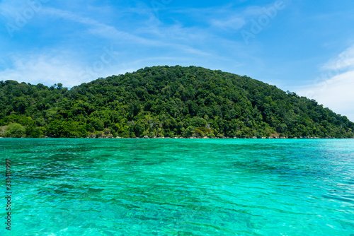 View of  Surin national island  in Andaman ocean at  Southern of Thailand  very beautiful clearly turquoise water and absolutely coral reef. Travel destination for summer vacation photo.