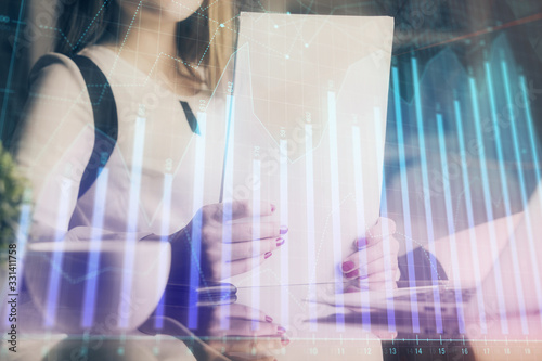 Wallpaper Mural Double exposure of hands making notes with forex chart huds. Stock market concept. Torontodigital.ca