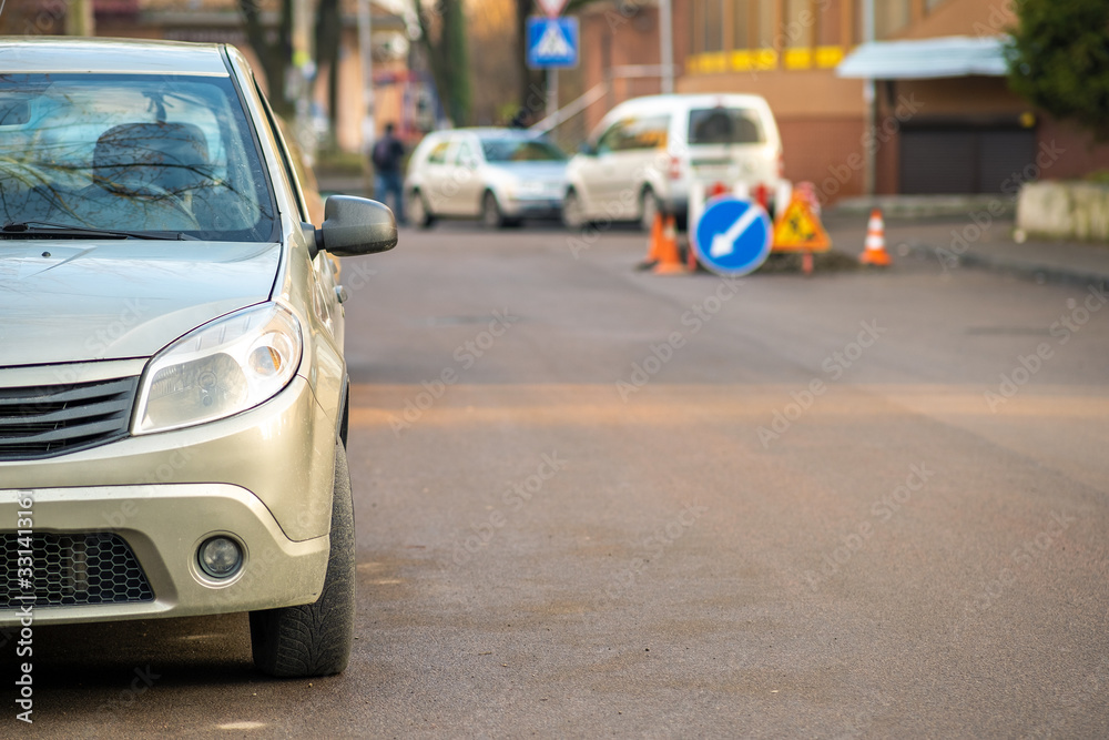 Kyiv, Ukraine - February 16, 2020: Modern cars parked on city street side in residential discrict. Shiny vehicles parked by the curb. Urban transportation infrastructure concept.