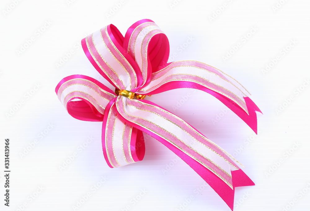 Red and white ribbon bow on white background Red and white ribbon bow on white background