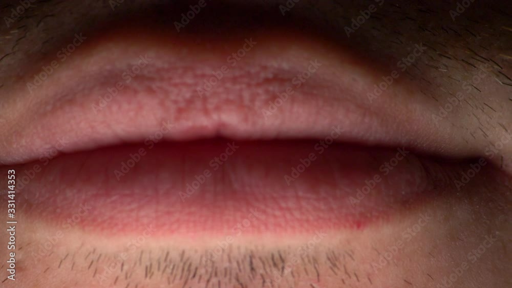 A man smiling and mouth opening and closing - macro