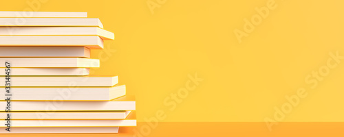 Foto Yellow books isolated on yellow background with copy space