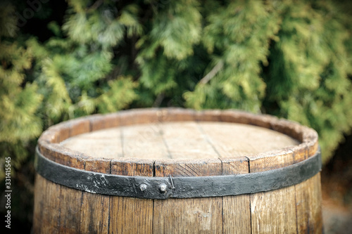 Old wooden barrel in garden and free space for your decoration.  © magdal3na