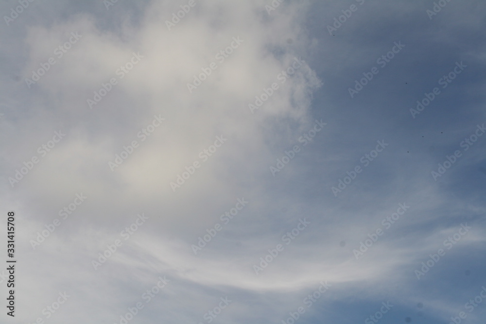 white clouds against a blue sky