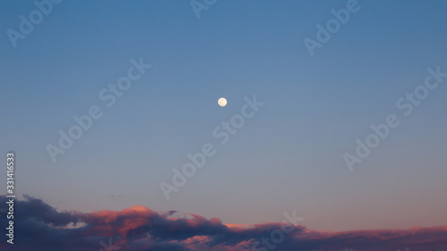 sunset in the sky, full moon and clouds