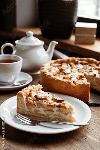 Table in a cafe, tea with apple pie.