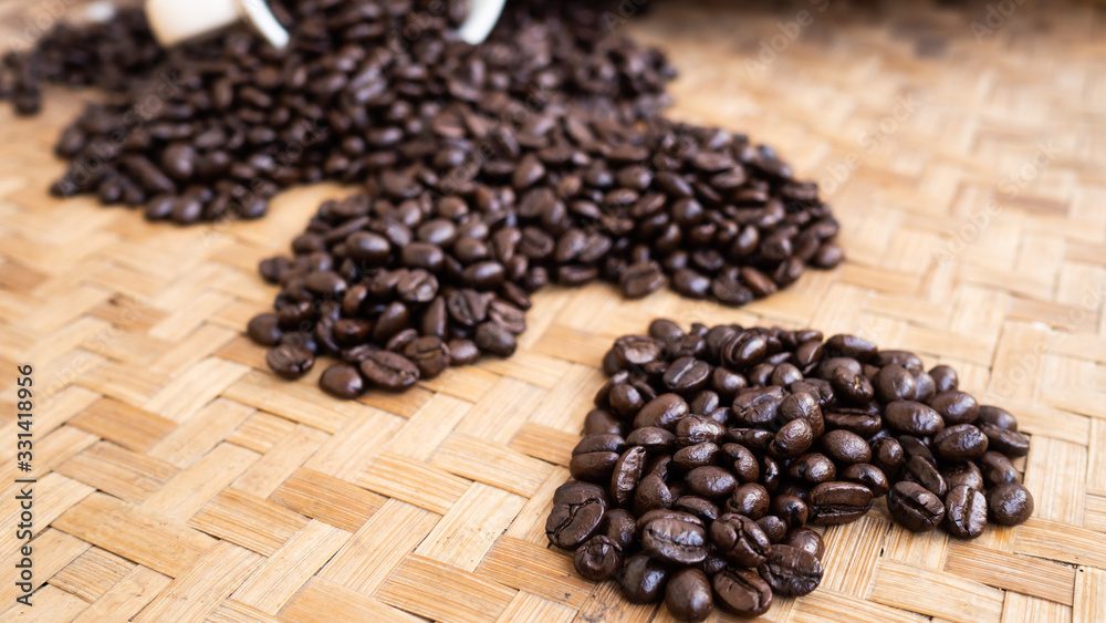 Fototapeta premium dark rose coffee bean, Black coffee cup on old wooden table top view.