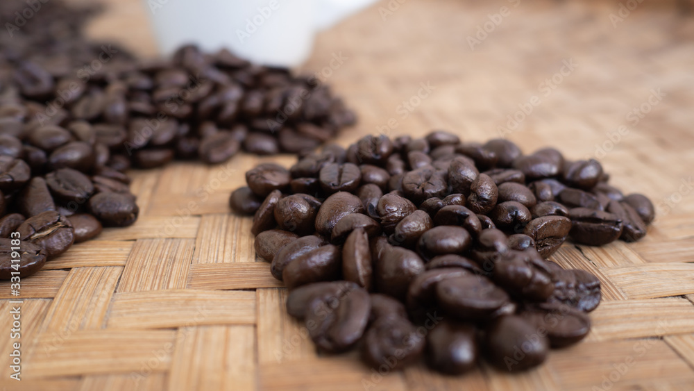 Fototapeta premium dark rose coffee bean, Black coffee cup on old wooden table top view.