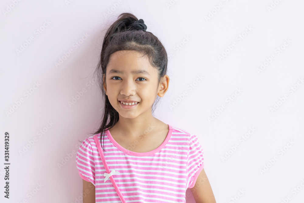 The child tied up black hair and smiled happiness. The child tied up black hair and smiled happiness.