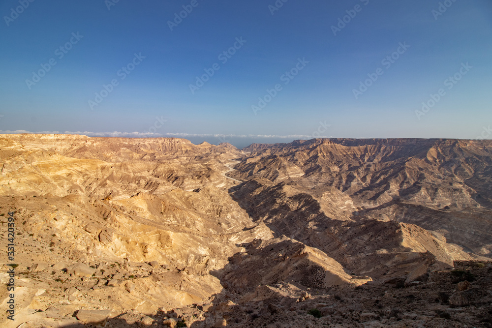 view through Canyon to the ocean along the coastal road to Salalah in Oman