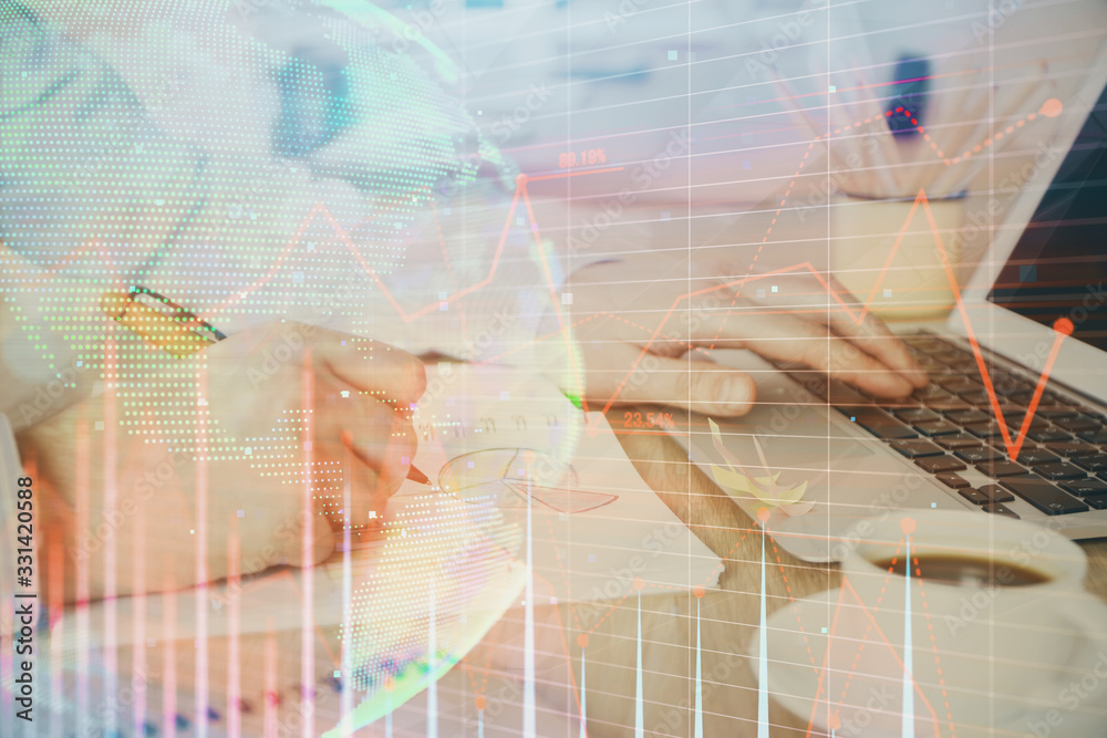 Multi exposure of stock market graph with man working on laptop on background. Concept of financial analysis. Multi exposure of stock market graph with man working on laptop on background. Concept of financial analysis.