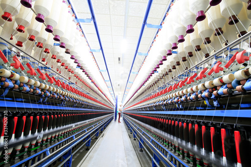 The modern spinning machine works in the workshop