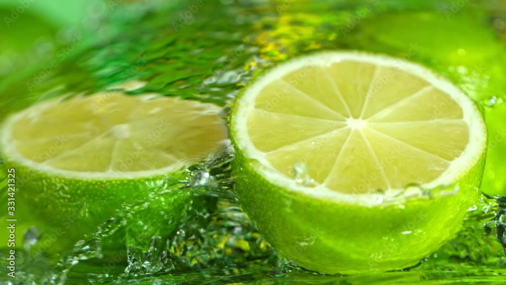 Super Slow Motion Shot of Water Splashing on Fresh Lime 1000fps.