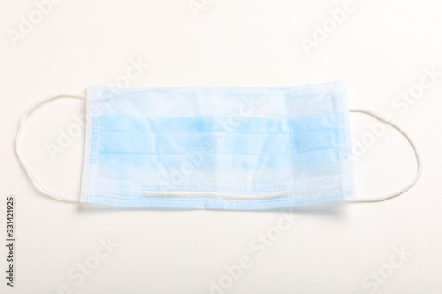 Medical mask for protection against flu and corona virus on white background