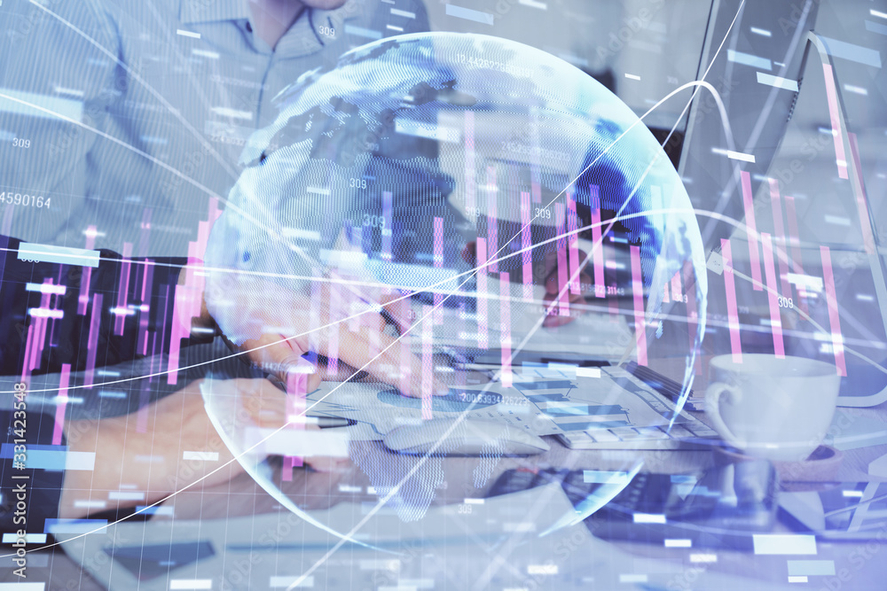Multi exposure of chart with man typing on computer in office on background. Concept of hard work. Multi exposure of chart with man typing on computer in office on background. Concept of hard work.