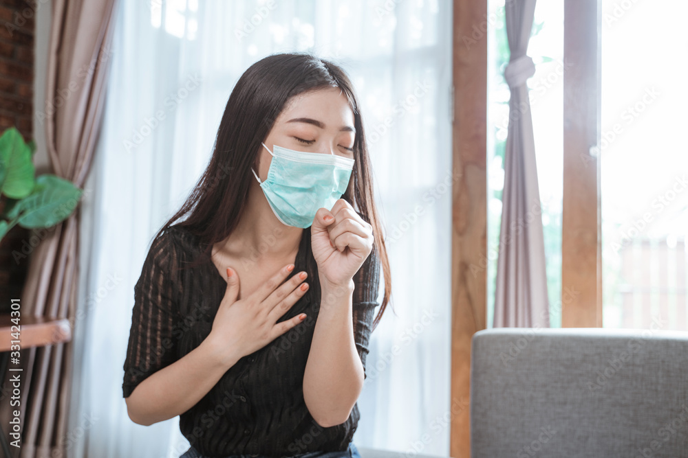 asian woman coughing at home wearing face masks asian woman coughing at home wearing face masks