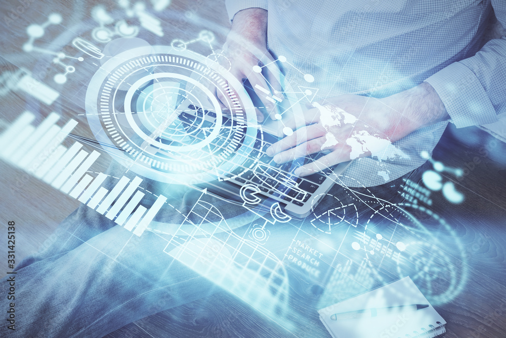 Double exposure of businessman working on laptop on background. International business hologram in front. Concept of success. Double exposure of businessman working on laptop on background. International business hologram in front. Concept of success.