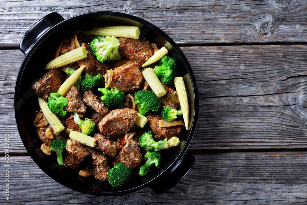 Pork chunks roasted in the oven with broccoli