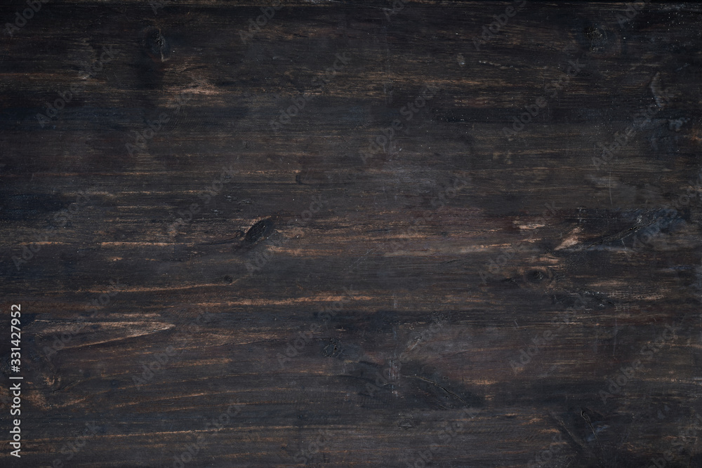 Naklejka premium Dark wooden plank background. Vintage and retro style.