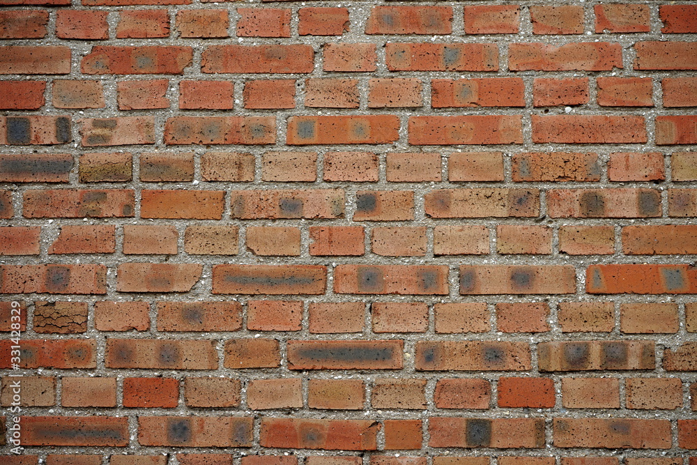 Background texture of an old wall built of red brick Background texture of an old wall built of red brick