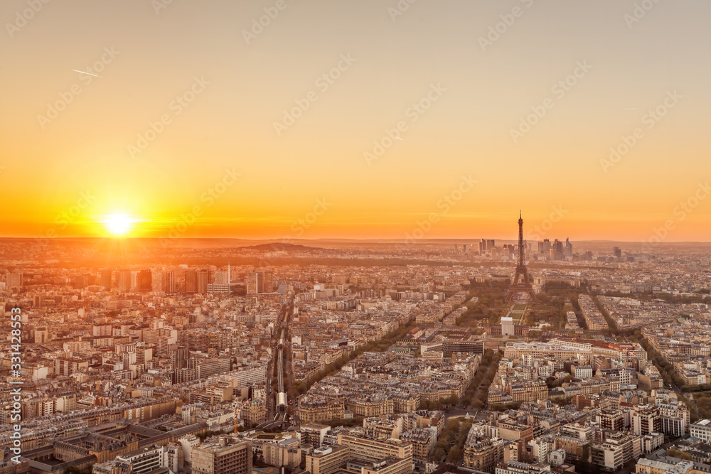 Panorama of Paris with Eiffel Tower against sunset in France