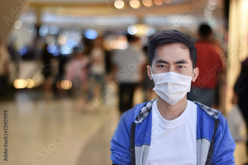 Coronavirus, Asian man wearing mask face. protection outbreak Covid 2019 in public area at airport station.