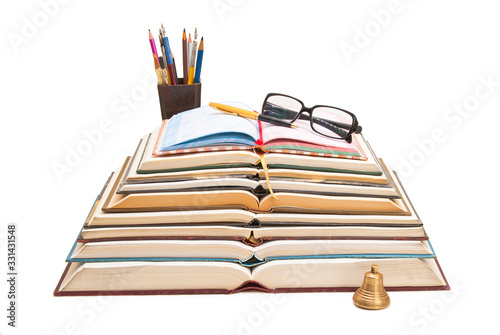 Books, pens and sunglasses in a single composition.