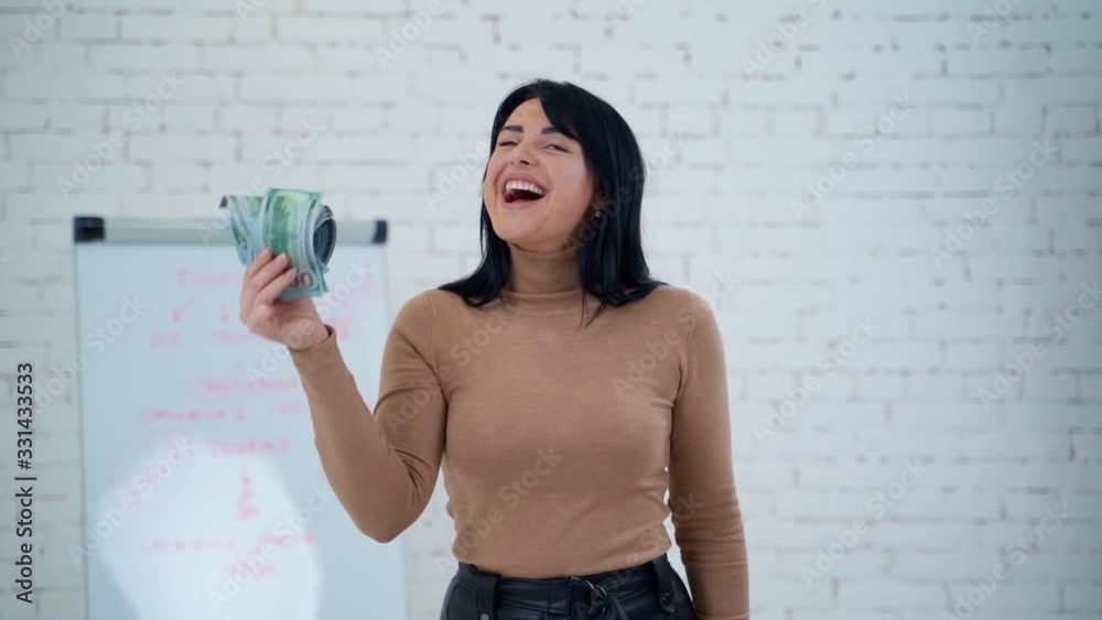 Girl holding money. Business woman holding stack of money Girl holding money. Business woman holding stack of money
