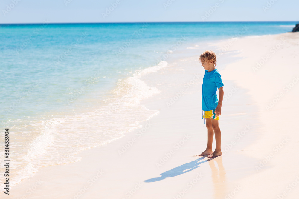 Kids playing on beach. Children play at sea.