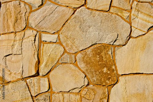 A background fragment of a stone wall
