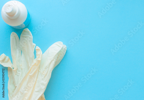 medical gloves, syringe, buckwheat, medical protective mask, antibacterial antiseptic on a blue background. Coronavirus, flu virus outbreak, epidemic panic, pandemic
