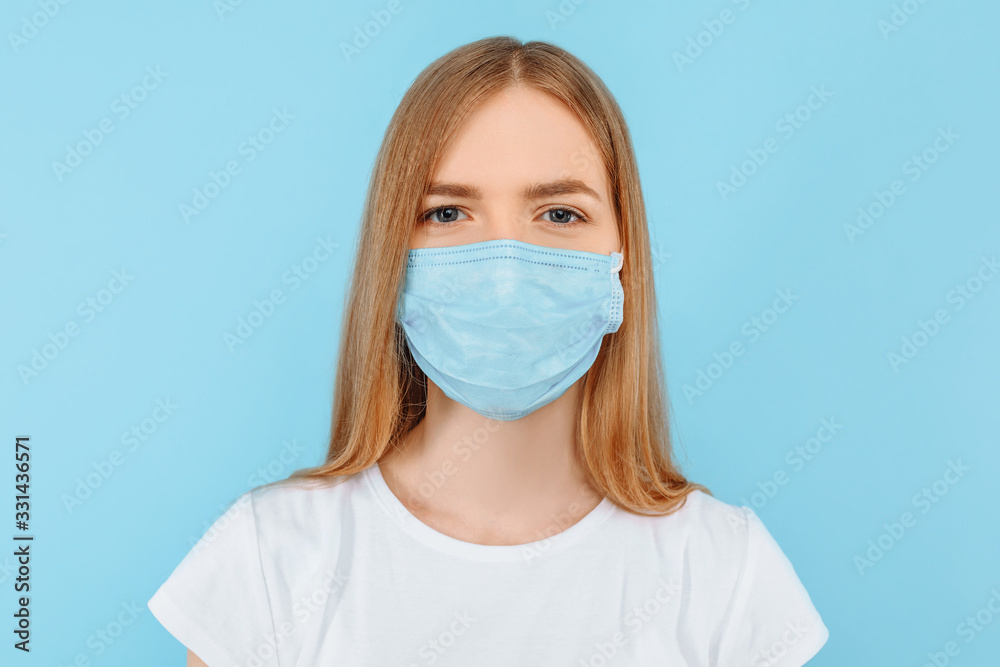 Protection from infectious diseases, coronavirus. A young girl wears a hygiene mask to prevent infection Protection from infectious diseases, coronavirus. A young girl wears a hygiene mask to prevent infection