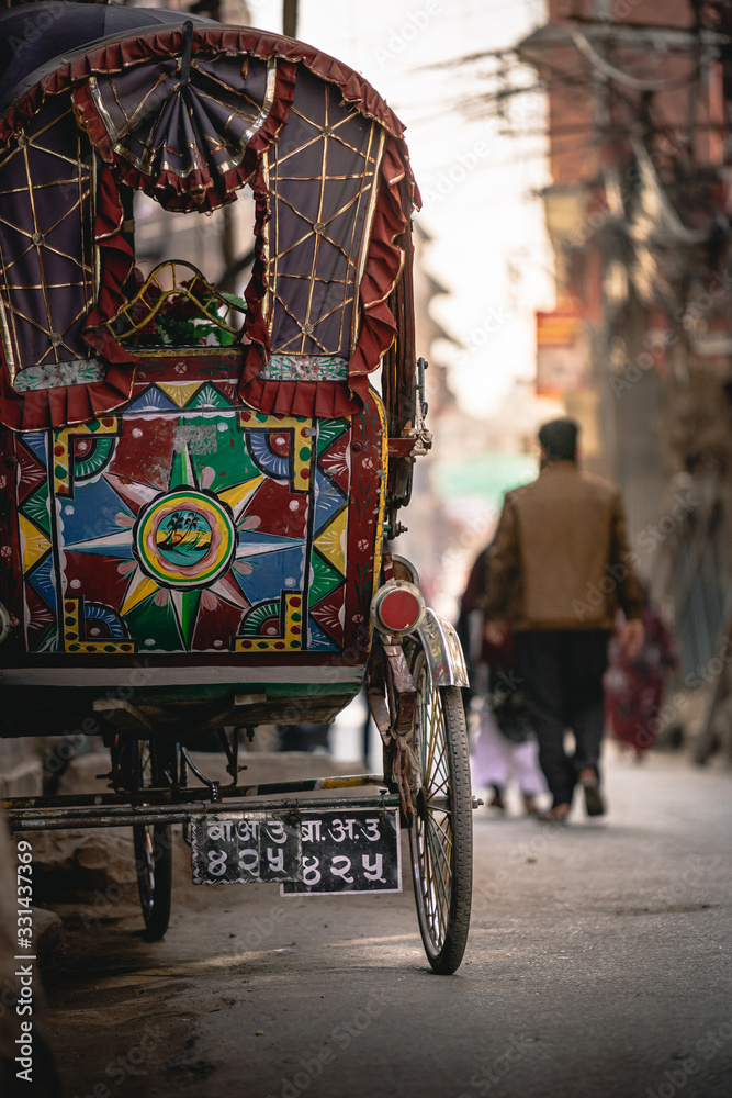 A colorful rickshaw parked in the streets of Kathmandu, Nepal
