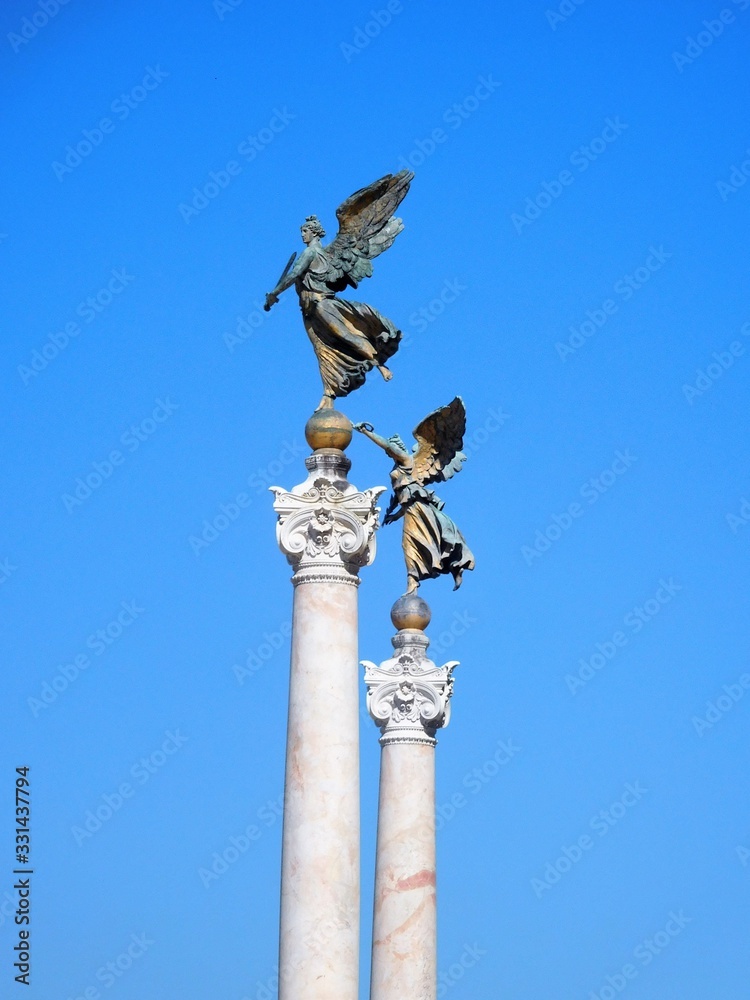 Statue in Rome, Italy against clear blue summer sky Statue in Rome, Italy against clear blue summer sky