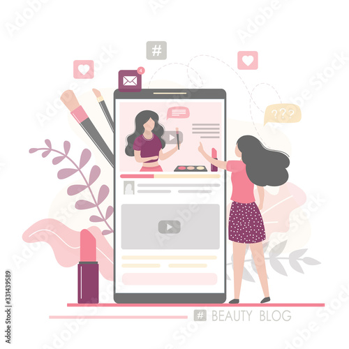 Fashion woman watching beauty blog and talking on smartphone. The female blogger talks about the latest cosmetics.