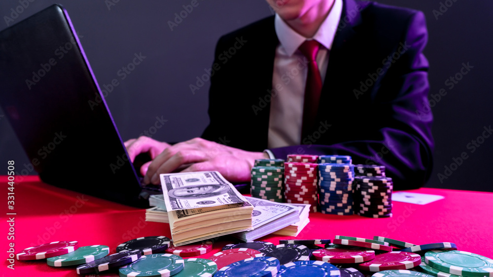 man is sitting at the poker table. poker game. online casino man is sitting at the poker table. poker game. online casino