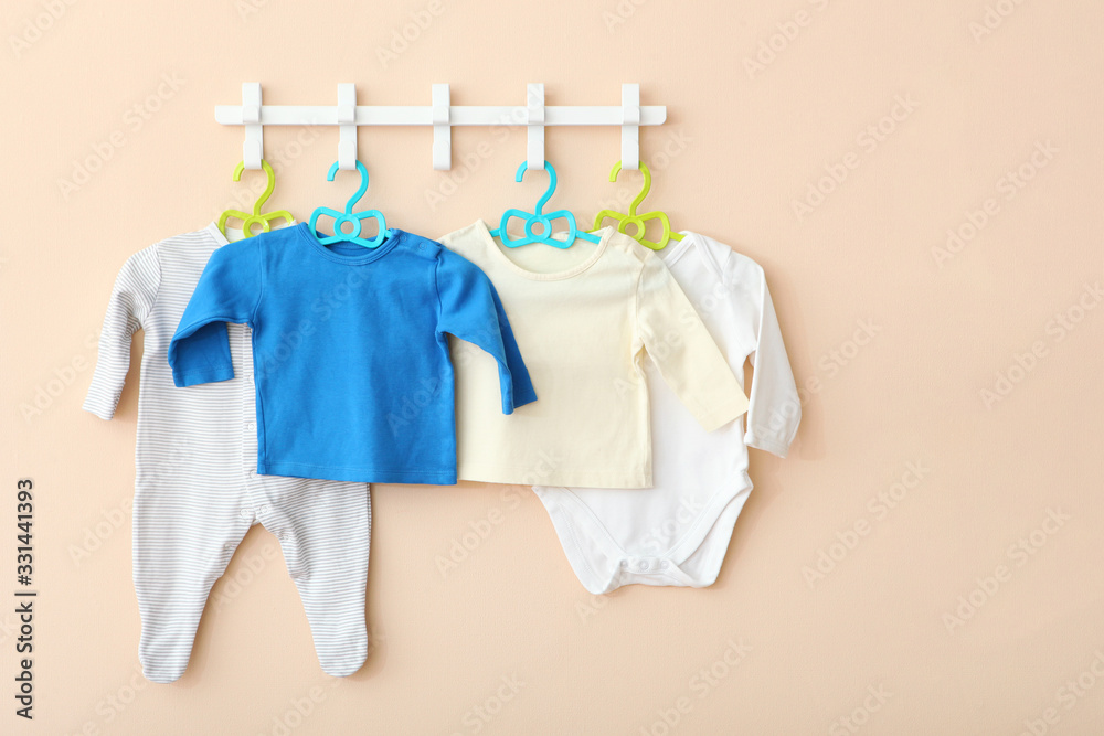 Baby clothes on a hanger. Place for text, minimalism.