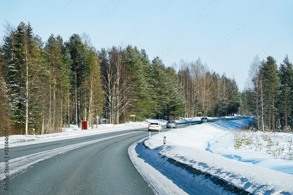 Obraz premium Car at a road at snowy winter Lapland
