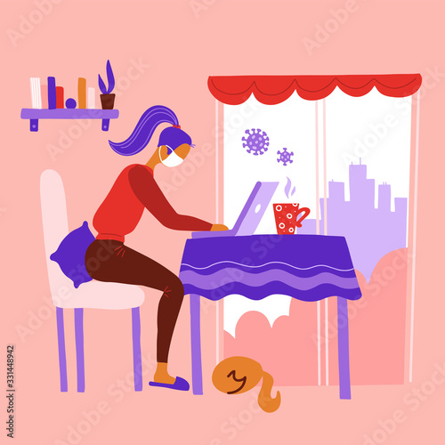 Work from home during outbreak of the COVID-19 virus. People work at home to prevent virus infection. Woman working on the kitchen table near womdow with a cat. Girl in mask works on laptop at home.