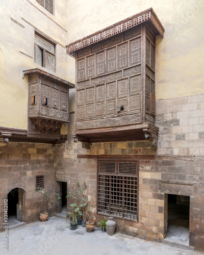 Facade of ottoman era historic house of El Sehemy with wooden oriel windows - Mashrabiya - located at Moez Street, Medieval Cairo, Egypt photo