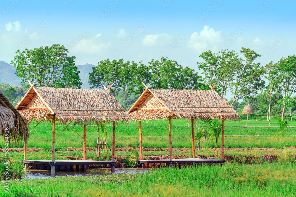 The resting huts constructed from bamboo and thatched roofs for relaxing in the rice fields. The resting huts constructed from bamboo and thatched roofs for relaxing in the rice fields.