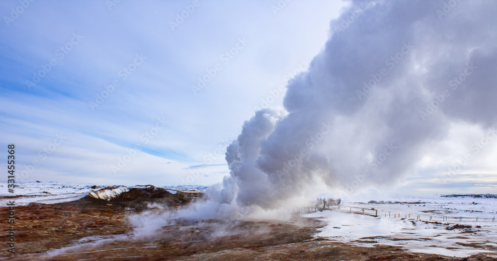 water vapour comes out of the ground in winter landscape