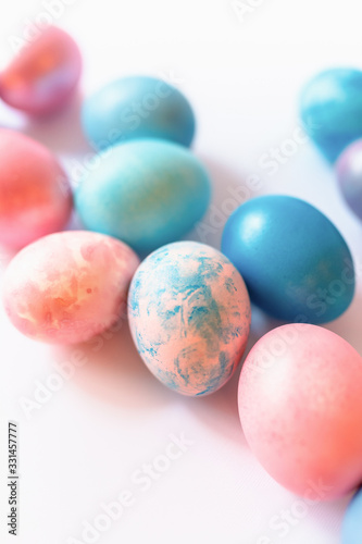 Pink and blue easter eggs on a white background.