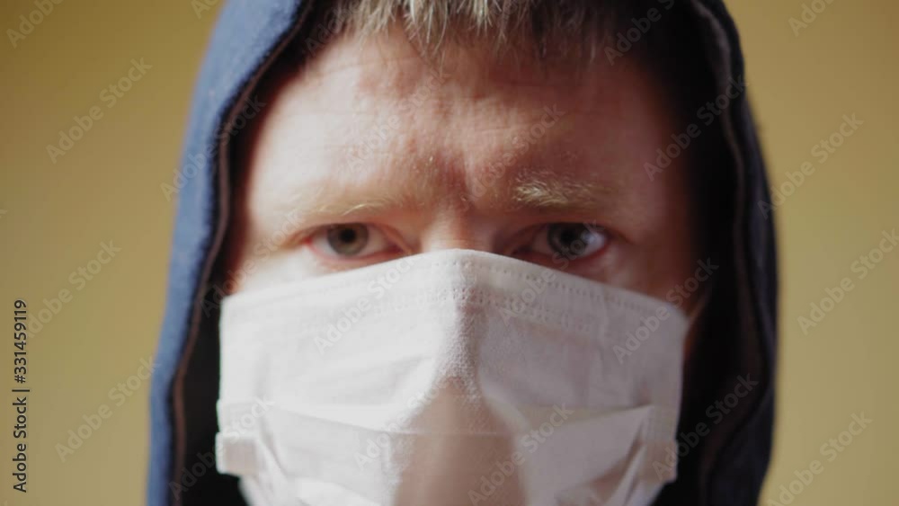 Portrait of a forty year old man in a medical mask. Pandemic COVID-19. Close up Portrait of a forty year old man in a medical mask. Pandemic COVID-19. Close up