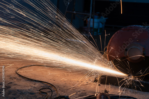 Cutting metal with cutting machine.